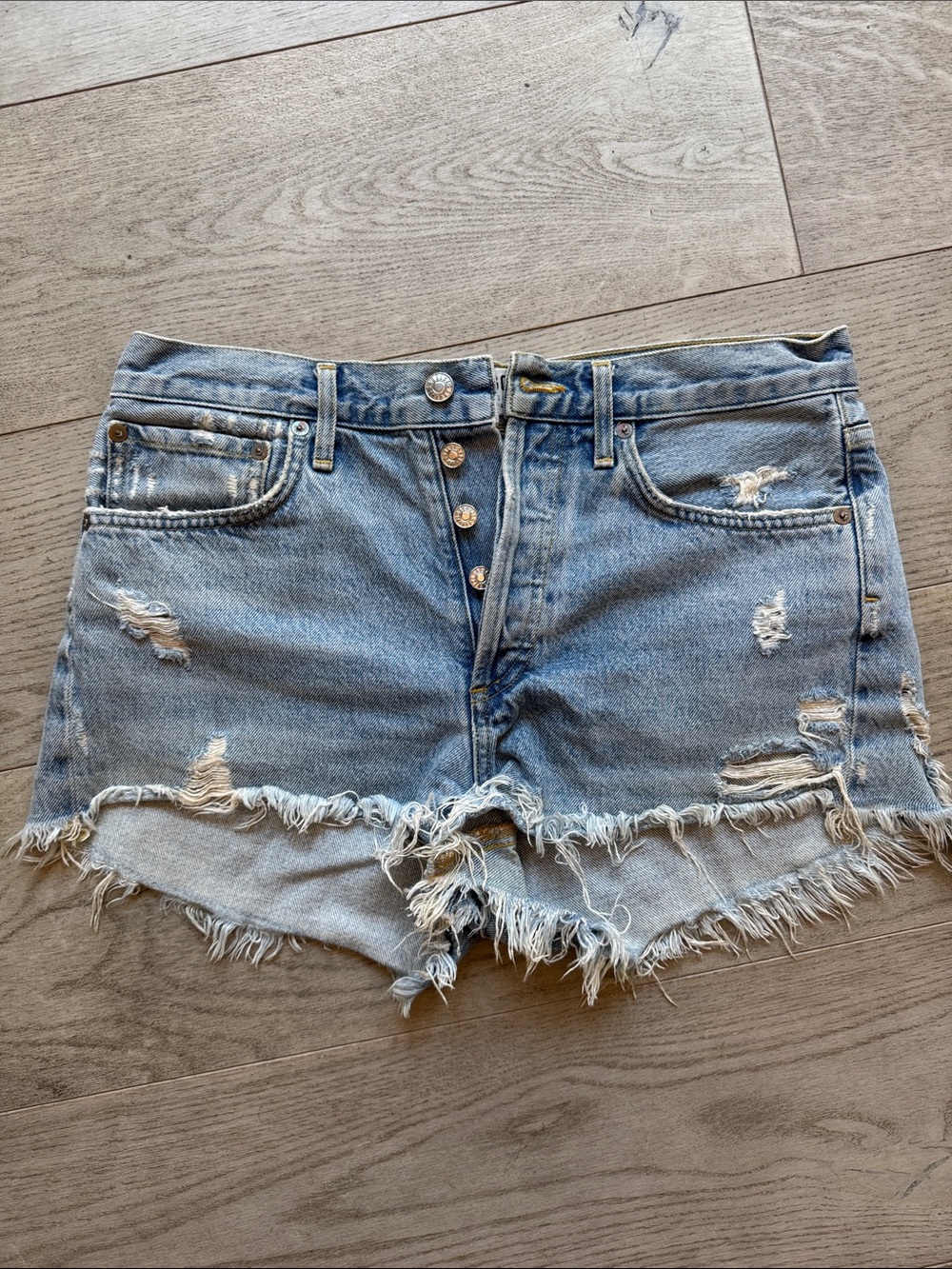 Agolde Light Blue Distressed Denim Cutoff Shorts